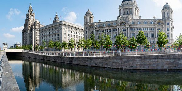 Liverpool Pier head featuring the 3 graces reflected in the canal Liverpool Pier head featuring the 3 graces reflected in the canal
